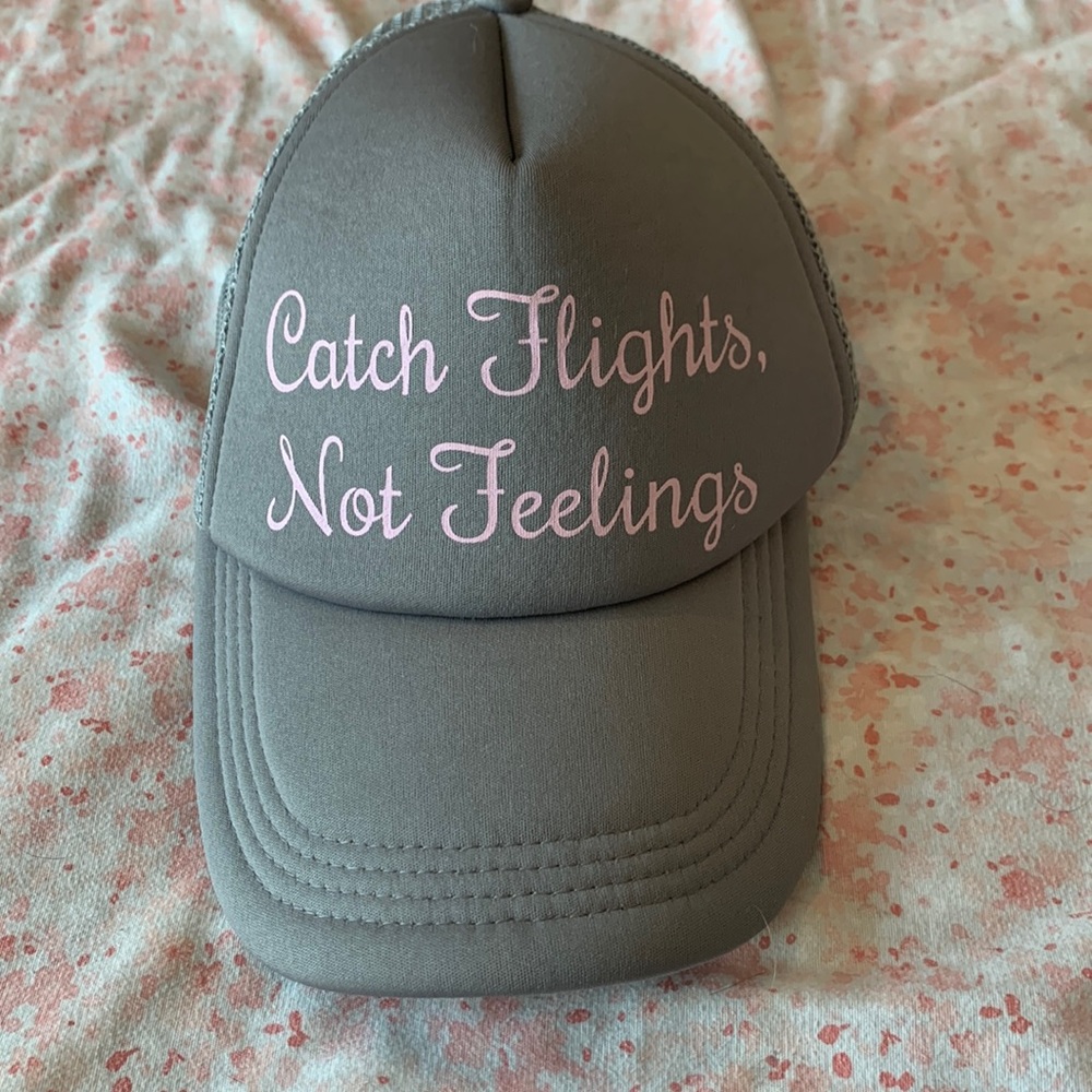 Women grey hat “ catch flights not feelings”